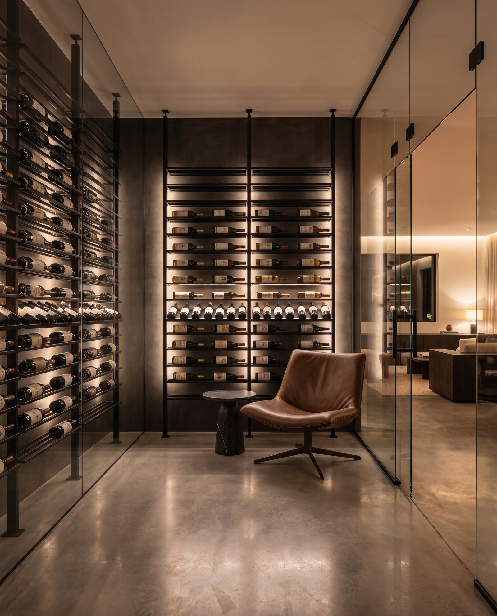 A private cellar lounge: backlit racks, a leather chair, and a glass wall to the living room beyond
